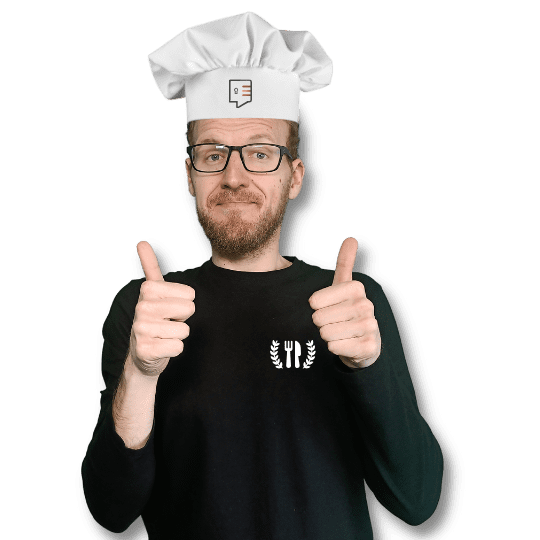 Alejandro giving thumbs up with a chef hat